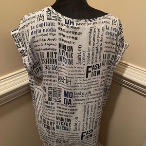 This lightweight newspaper print V-neck can be dressed up or dressed down!